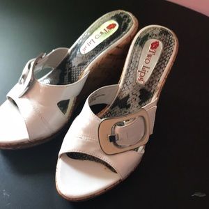 White strap with buckle and faux cork heel